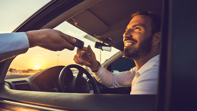 Happy driver receiving keys