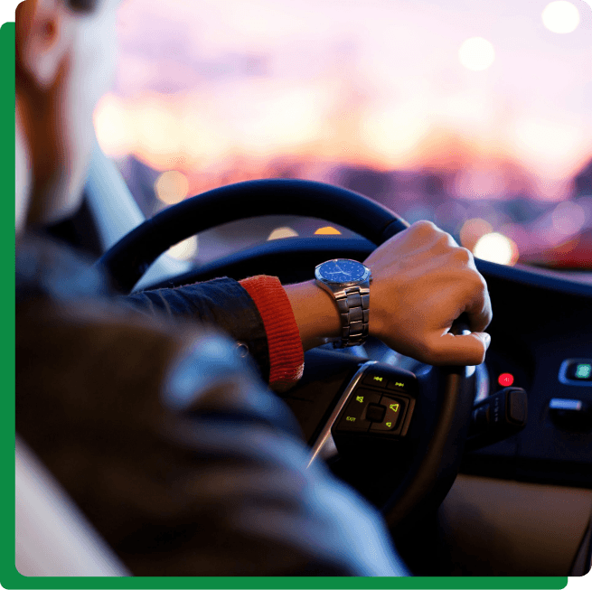 Driver's hands on steering wheel